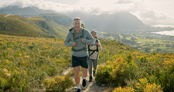 2 people hiking in the mountains